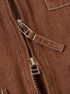 The Brown Meco Denim Marine Gilet is shown from the back, laid flat against a solid white background. The image highlights the rear construction of the vest, featuring a straight hem and tonal stitching.