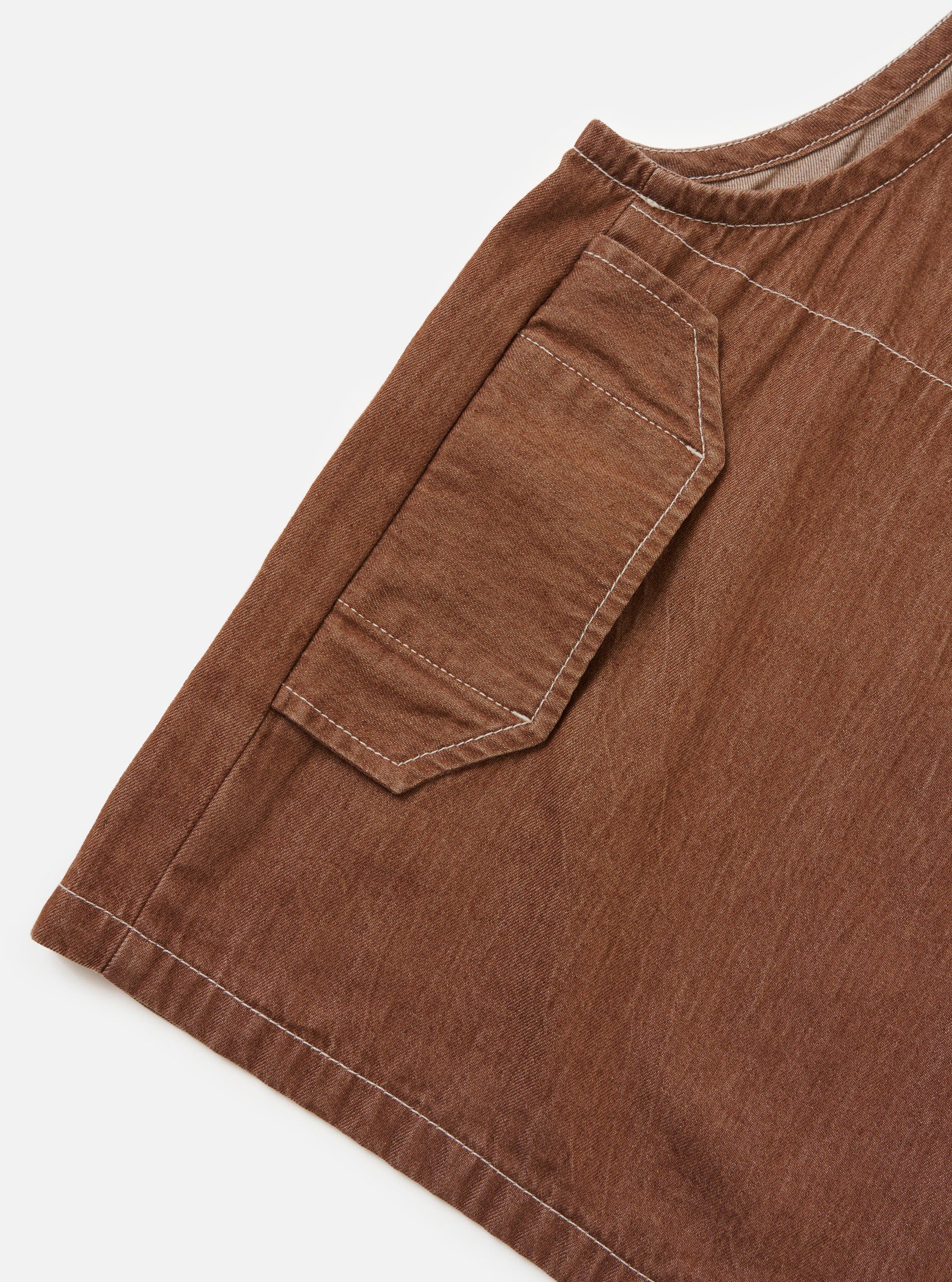 The Brown Meco Denim Marine Gilet is shown from the back, laid flat against a plain white background. The image highlights the rear construction of the vest, featuring a large kangaroo pocket spanning the lower back and a small locker loop at the back of the neck.