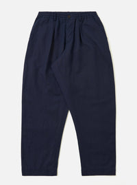 The Navy Linen Slub Weave Oxford Pant is shown laid flat against a plain white background. The deep navy trousers feature a loose, wide-leg silhouette, an elasticated waistband with a prominent external drawstring, and side slip pockets. The image highlights the irregular slubbed texture of the linen-cotton fabric.