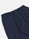 A Navy Linen Slub Weave Oxford Pant is shown from a rear view, laid flat against a plain white background. The image highlights the elasticated waistband with tonal stitching and a single patch pocket on the right side. The dark navy fabric features a distinct, irregular slubbed texture throughout.