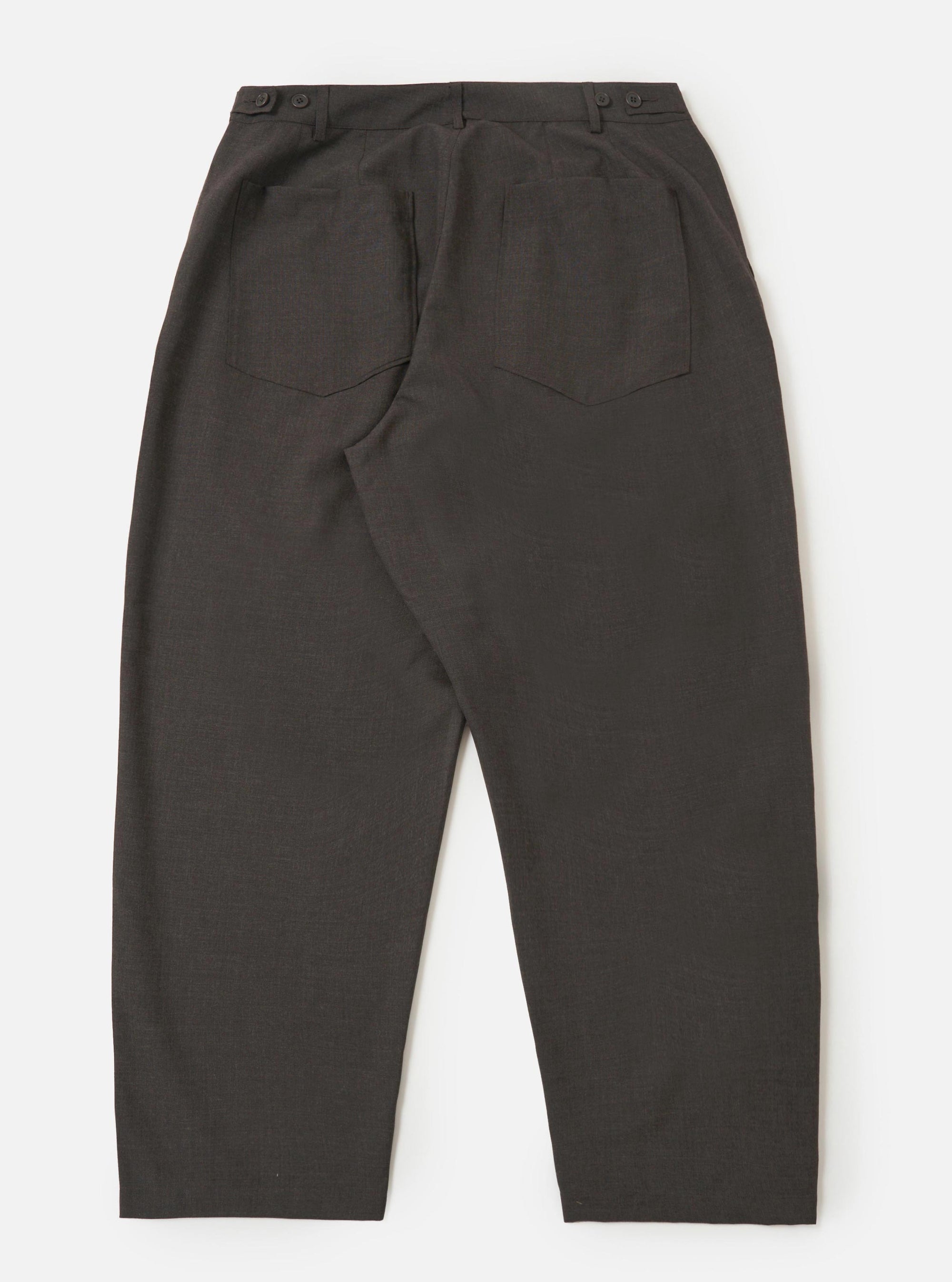 The back of the Brown Marl Tropical Suiting Dutch Pant is shown laid flat against a plain white background. The image highlights the wide-leg cut, two large rear patch pockets, and buttoned waist adjusters on the side.