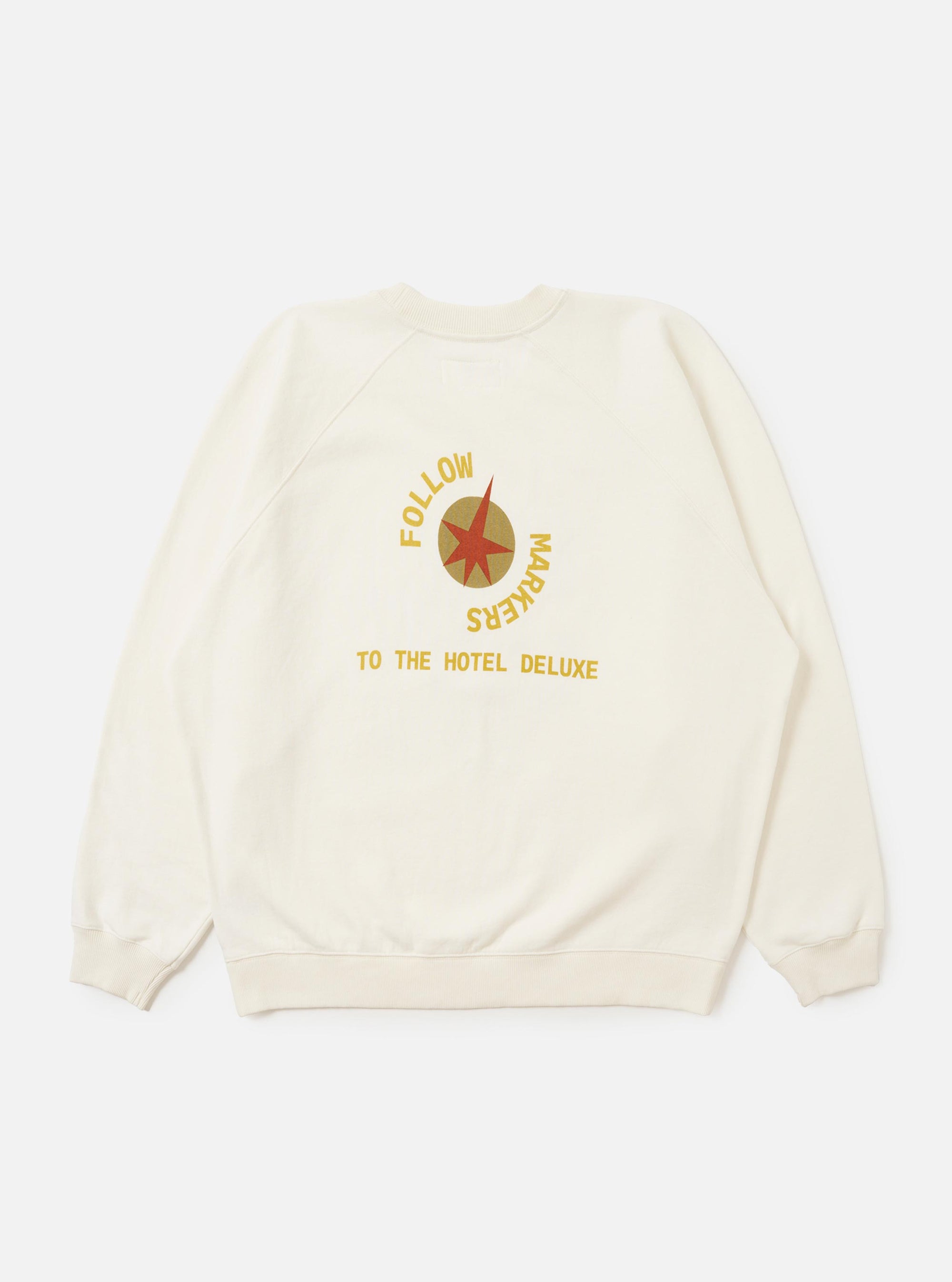 The Ecru Brush Back Sweat FM Raglan Sweatshirt is shown from the back, laid flat against a plain white background. The image highlights the raglan sleeve construction, ribbed cuffs, and a ribbed hem.
