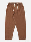 A pair of brown Meco denim Hi Water trousers is shown laid flat against a solid white background. The trousers feature a slim, cropped fit with a drawstring waistband and side pockets.