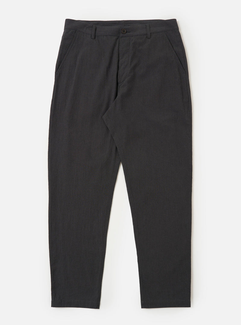 A pair of charcoal grey cotton military chinos is displayed flat against a plain white background. The trousers feature a straight leg, side slip pockets, and a buttoned waistband.