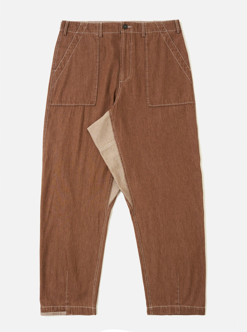 A pair of brown Meco denim patched fatigue pants is displayed flat against a plain white background. The trousers feature a straight leg, large front patch pockets with contrast stitching, and a buttoned waistband.