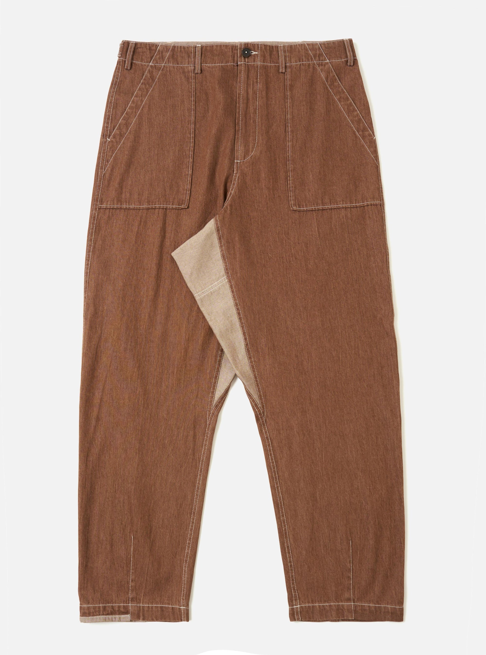 A pair of brown Meco denim patched fatigue pants is displayed flat against a plain white background. The trousers feature a straight leg, large front patch pockets with contrast stitching, and a buttoned waistband.