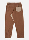 A pair of brown Meco denim patched fatigue pants is shown from the back, laid flat against a plain white background. The image highlights the two large rear patch pockets and the straight-leg cut of the trousers.
