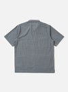 A pale blue and white check plaid summer overshirt is displayed flat against a plain white background. The garment features a pointed collar, a full button-down front, and two large patch pockets on the chest.