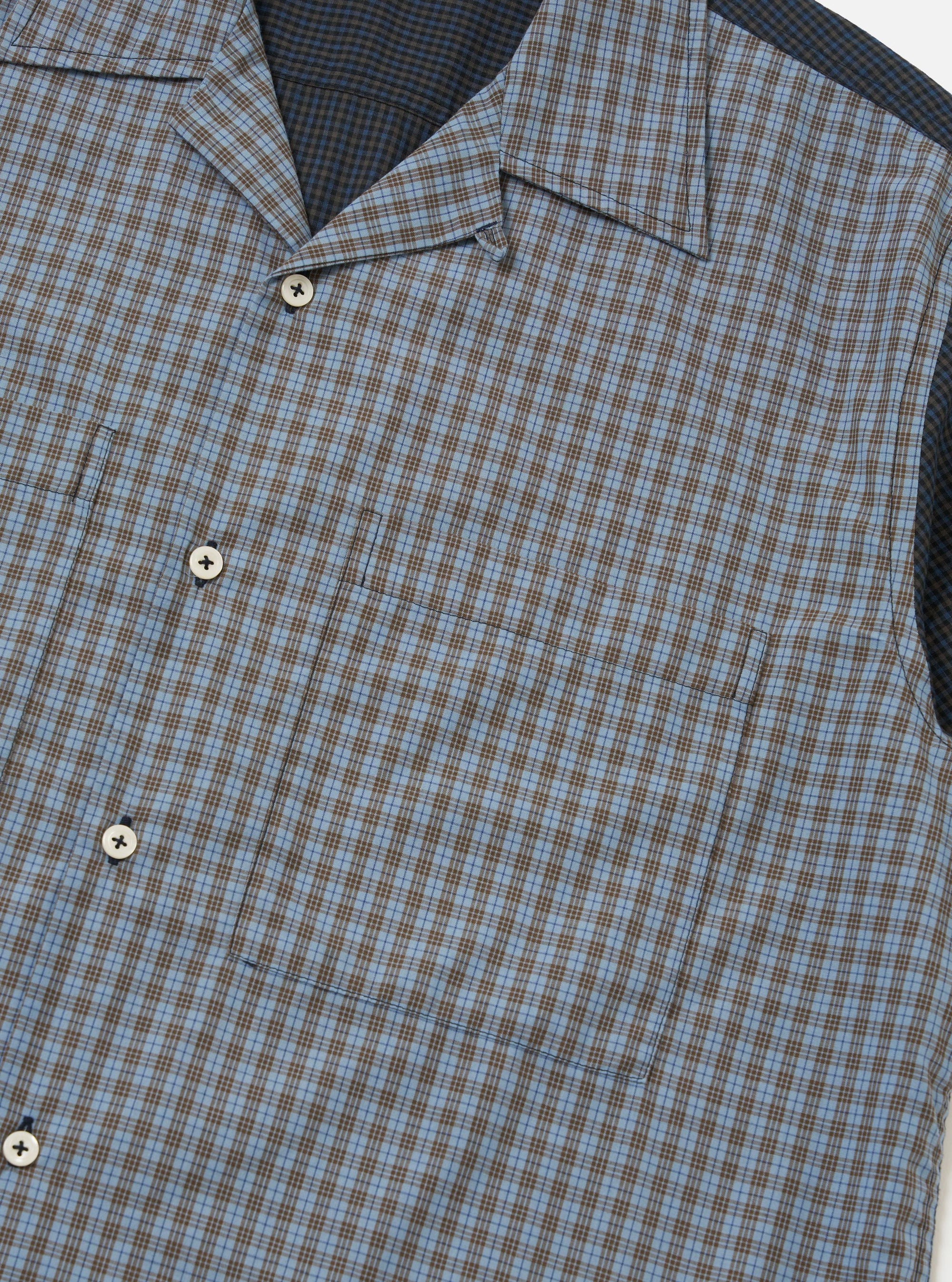 A Mixed Check Plaid Camper Shirt is displayed flat against a plain white background. The garment features a short-sleeve silhouette with a multi-colored patchwork plaid pattern and a camp collar.