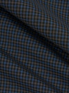 A close-up fabric swatch of the Mixed Check Plaid Camper Shirt features an intricate variety of intersecting check and plaid patterns in a multi-colored palette. The image focuses on the detailed texture and weave of the material.