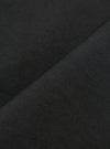A close-up fabric swatch of the Black Broadcloth Oxford Pant shows a detailed view of the black broadcloth material. The image highlights the smooth, tightly woven texture of the cotton fabric against a neutral background.