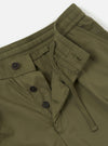A pair of olive green broadcloth Oxford pants is shown from the back, laid flat against a plain white background. The image highlights the rear construction, including a single buttoned flap pocket on the right side and a clean waistband.