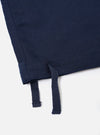 The Navy Linen Cotton Shirting Parachute Pant is shown from a rear perspective, laid flat against a solid white background. The image highlights the two large rear accordion patch pockets with buttoned flaps and the drawstring adjustable hems at the bottom of the wide legs.