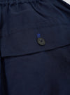 The Navy Linen Cotton Shirting Parachute Pant is shown from the back, laid flat against a plain white background. The image highlights the two large rear patch pockets, the elasticated waistband, and the relaxed, straight-leg silhouette of the dark navy trousers.