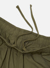 A pair of olive green cotton broadcloth vacation shorts is shown laid flat against a solid white background. The shorts feature a relaxed, wide-leg cut, an elasticated waistband with a drawstring, and side slip pockets.