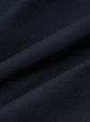 A close-up fabric swatch of the Navy Broadcloth Camp Shirt displays a smooth, tightly woven cotton fabric in a solid navy blue color. The image focuses on the uniform texture and fine weave of the material.