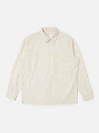 The Ecru Broadcloth Lucky Shirt is displayed laid flat against a plain white background. The shirt features a relaxed fit with a straight hem, a standard pointed collar, and a single large square pocket on the left chest. The short sleeves and full button-down front are clearly visible.