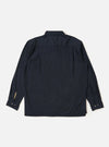 The Navy Broadcloth Lucky Shirt is shown from the back, displayed flat against a plain white background. The image highlights the shirt's straight hem, back yoke, and a central box pleat designed for a relaxed fit. The long sleeves are visible, and