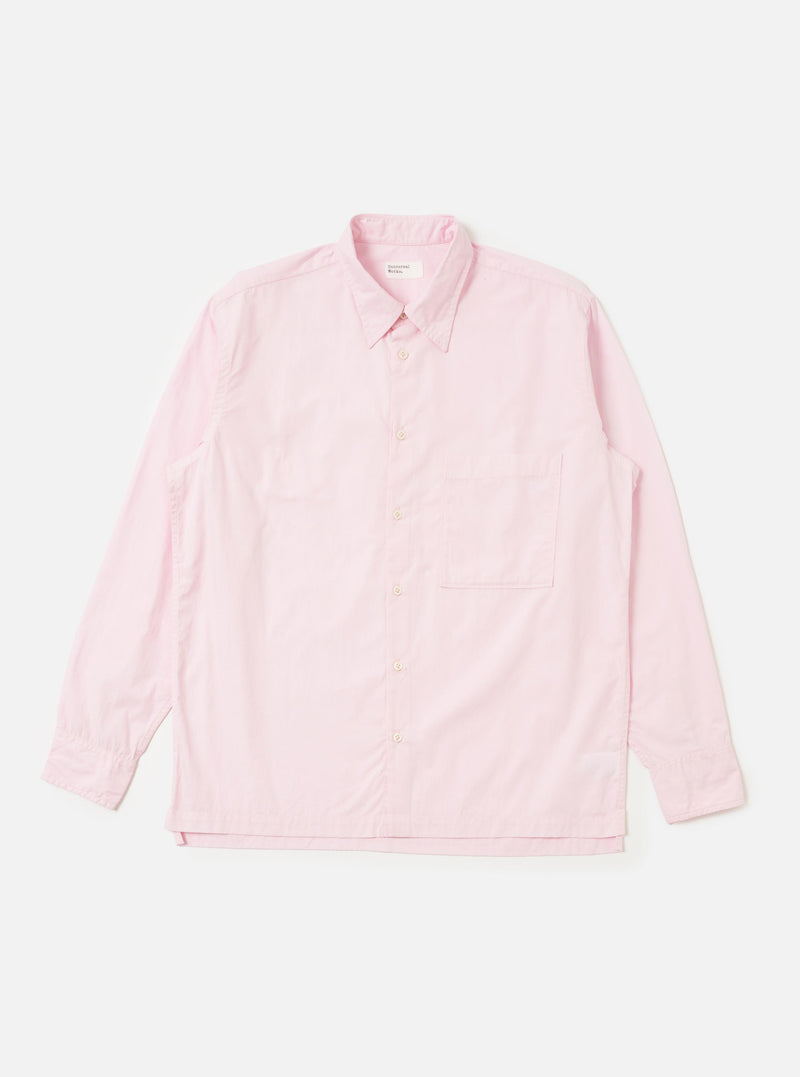 The Pale Pink Broadcloth Lucky Shirt is shown laid flat against a solid white background. The garment features a light pink color, a classic pointed collar, a full button-down front with tonal buttons, and a single chest pocket on the left side. The shirt has short sleeves and a straight hem.