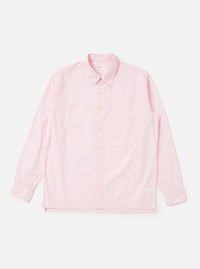 The Pale Pink Broadcloth Lucky Shirt is shown laid flat against a solid white background. The garment features a light pink color, a classic pointed collar, a full button-down front with tonal buttons, and a single chest pocket on the left side. The shirt has short sleeves and a straight hem.