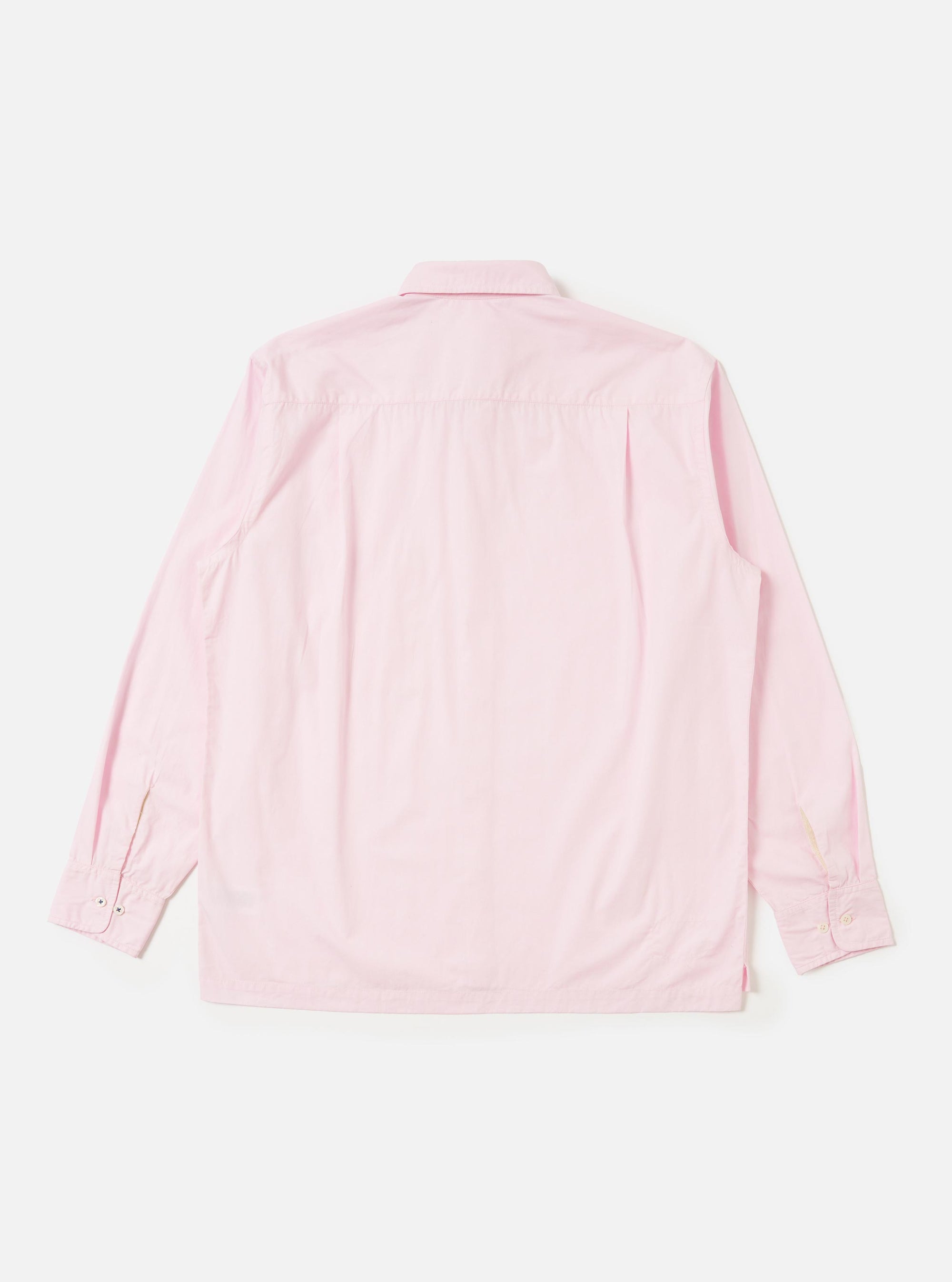 The Pale Pink Broadcloth Lucky Shirt is shown from the back, laid flat against a solid white background. The image highlights the back yoke and a central box pleat designed for a relaxed fit. The lightweight pale pink broadcloth fabric is the prominent feature of the garment.