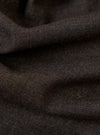 A close-up, square fabric swatch of the Brown Marl Tropical Suiting Vacation Short highlights the textured, woven appearance of the material. The fabric features a mix of brown and grey tones, creating a marled effect. No models, mannequins, or background elements are present in this detail-focused image.