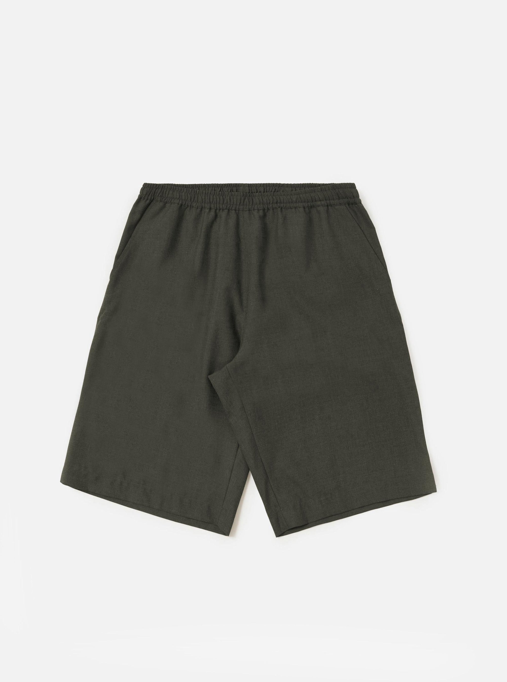 A pair of Olive Marl Tropical Suiting Vacation Shorts is displayed flat against a plain white background. The shorts feature an elasticated waistband with a drawstring, side pockets, and a relaxed, straight-leg fit.