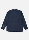 The Navy Linen Cotton Shirting Parachute Shirt is shown from the back, laid flat against a plain white background. The image highlights the horizontal back yoke with two small pleats and the adjustable buttoned cuffs on the long sleeves. The shirt features a straight hem and a collarless V-neckline.