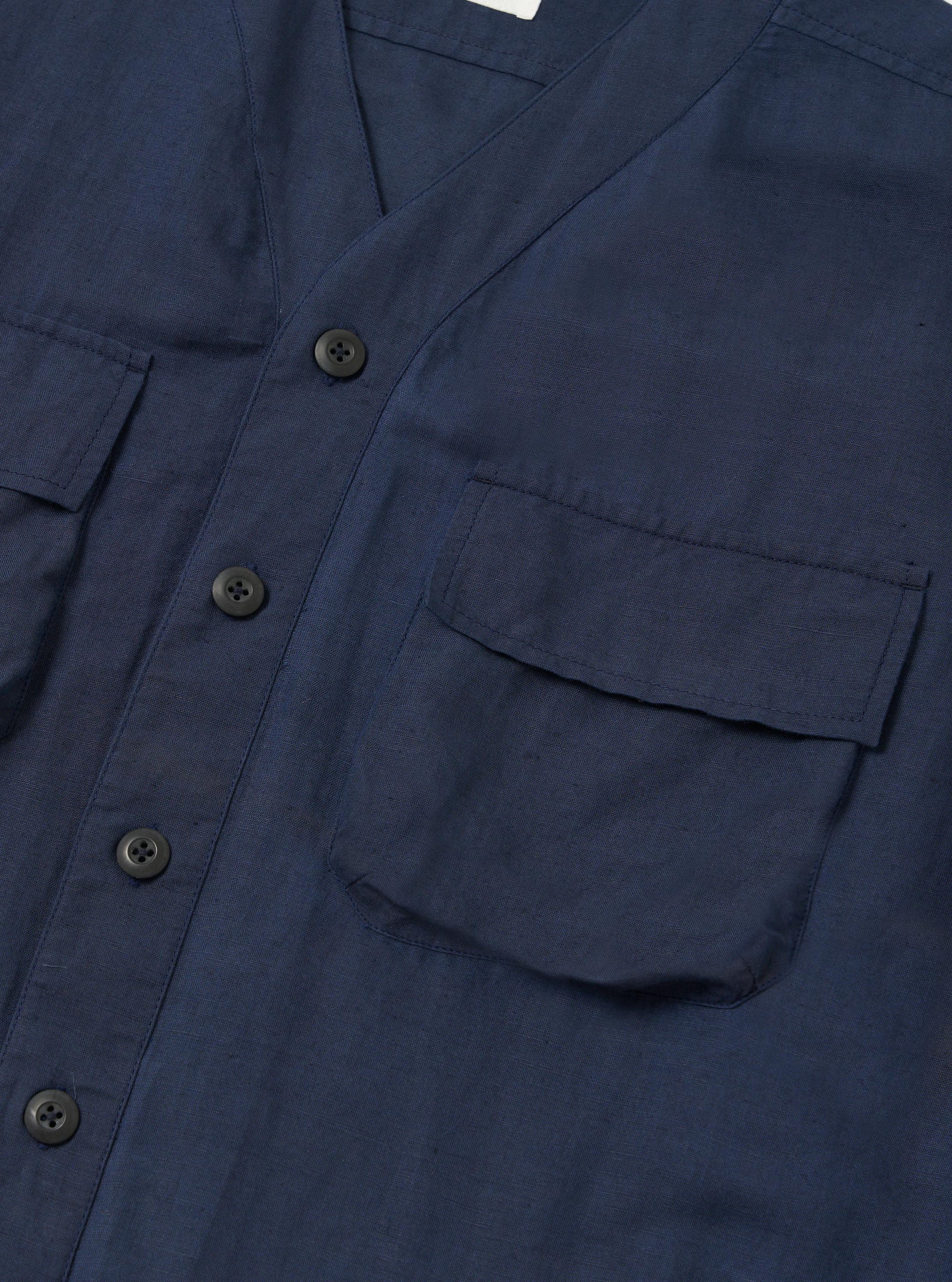 The Navy Linen Cotton Shirting Parachute Shirt is shown from the back, laid flat against a plain white background. The image highlights the back yoke and two small pleats that provide a relaxed fit.