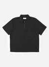 The Black Broadcloth Ewan Shirt is shown laid flat against a solid white background. This black pullover garment features a half-zip front, a classic pointed collar, and two large patch pockets on the chest.