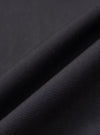 A close-up fabric swatch of the black broadcloth used for the Black Broadcloth Ewan Shirt. The image highlights the smooth, fine weave and deep black color of the material.