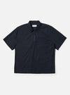 The Navy Broadcloth Ewan Shirt is shown laid flat against a solid white background. The navy blue pullover shirt features a classic pointed collar, a short quarter-zip at the neckline, and long sleeves.