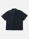 The Navy Broadcloth Ewan Shirt is shown from the back, displayed flat against a plain white background. The image highlights the short sleeves, a straight hem with side splits, and a horizontal yoke with a central box pleat designed for a relaxed fit.