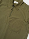 An Olive Broadcloth Ewan Shirt is shown from the back, displayed flat against a plain white background. The image highlights the short sleeves, a straight hem with side splits, and a horizontal back yoke with a central box pleat.