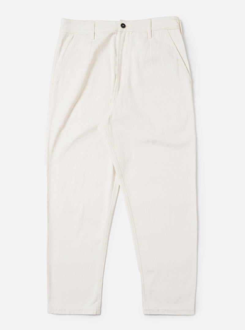 The Ecru Slub Drill Dizzy Trouser is displayed flat against a plain white background. The trousers feature a wide-leg silhouette, a buttoned waistband, and side slip pockets. The textured ecru cotton fabric is clearly visible.