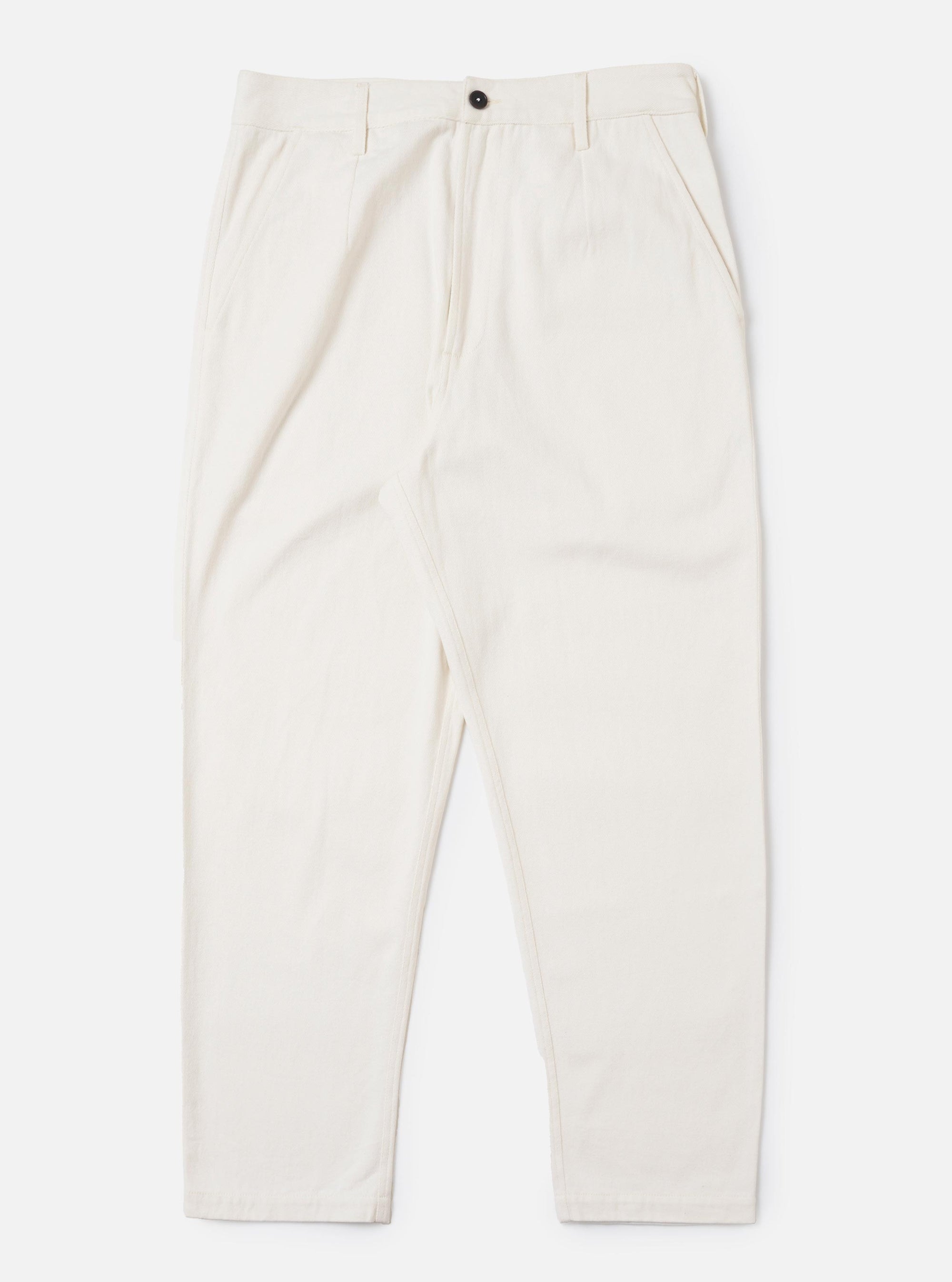 The Ecru Slub Drill Dizzy Trouser is displayed flat against a plain white background. The trousers feature a wide-leg silhouette, a buttoned waistband, and side slip pockets. The textured ecru cotton fabric is clearly visible.