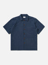 A Navy Chester Stripe S/S Fatigue Shirt is shown laid flat against a solid white background. The garment features a navy blue and white vertical stripe pattern, a classic pointed collar, a full button-down front, and two large chest pockets. The short sleeves are visible, and