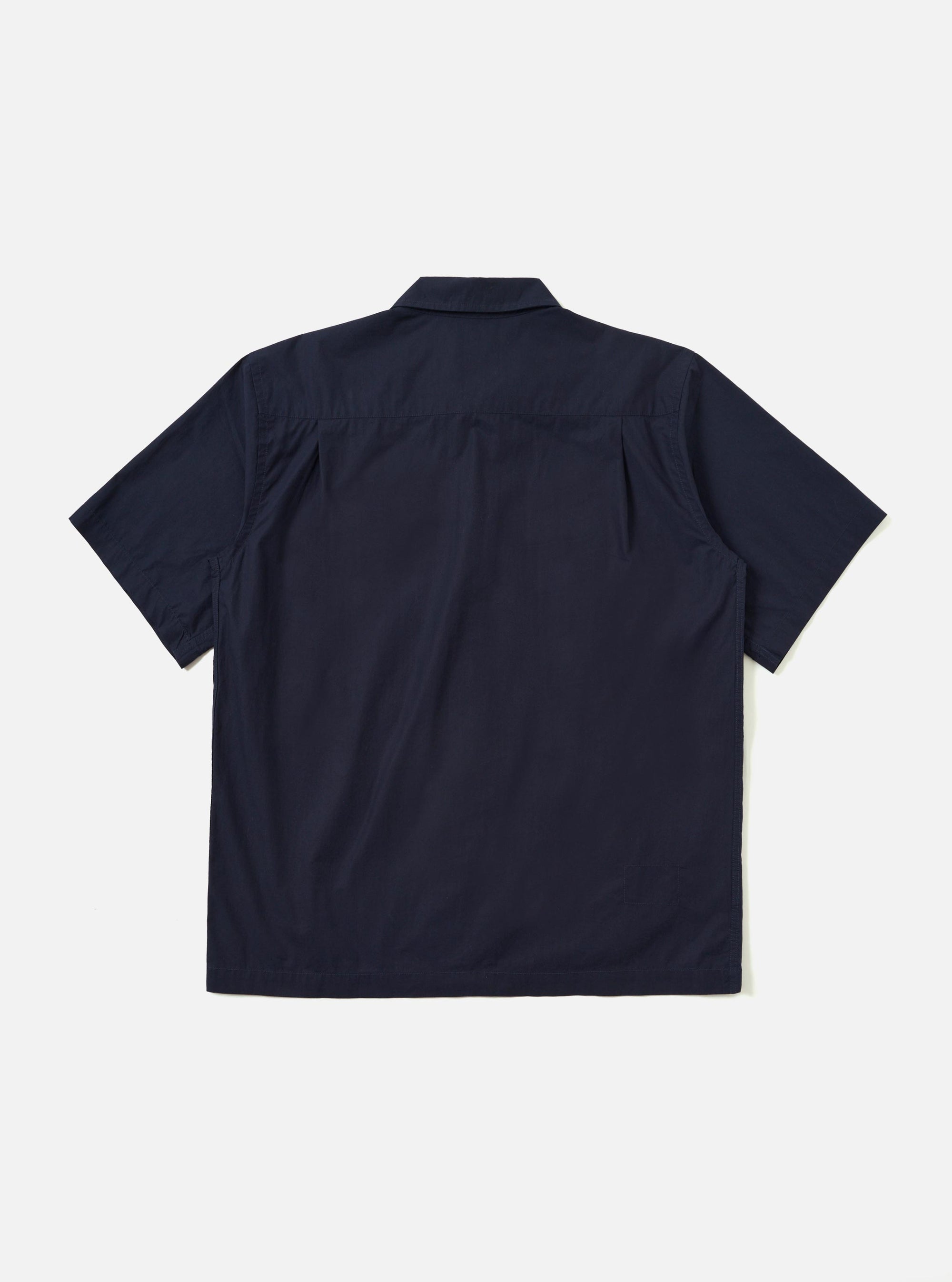 The back of the Navy Paper Touch Cotton S/S Fatigue Shirt is shown from a rear angle, laid flat against a plain white background. The image highlights the short sleeves, a straight hem, and a horizontal yoke across the shoulders.