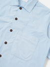The Sky Blue Paper Touch Cotton S/S Fatigue Shirt is shown from the back, laid flat against a plain white background. The image highlights the short sleeves, a straight hem, and a classic pointed collar.