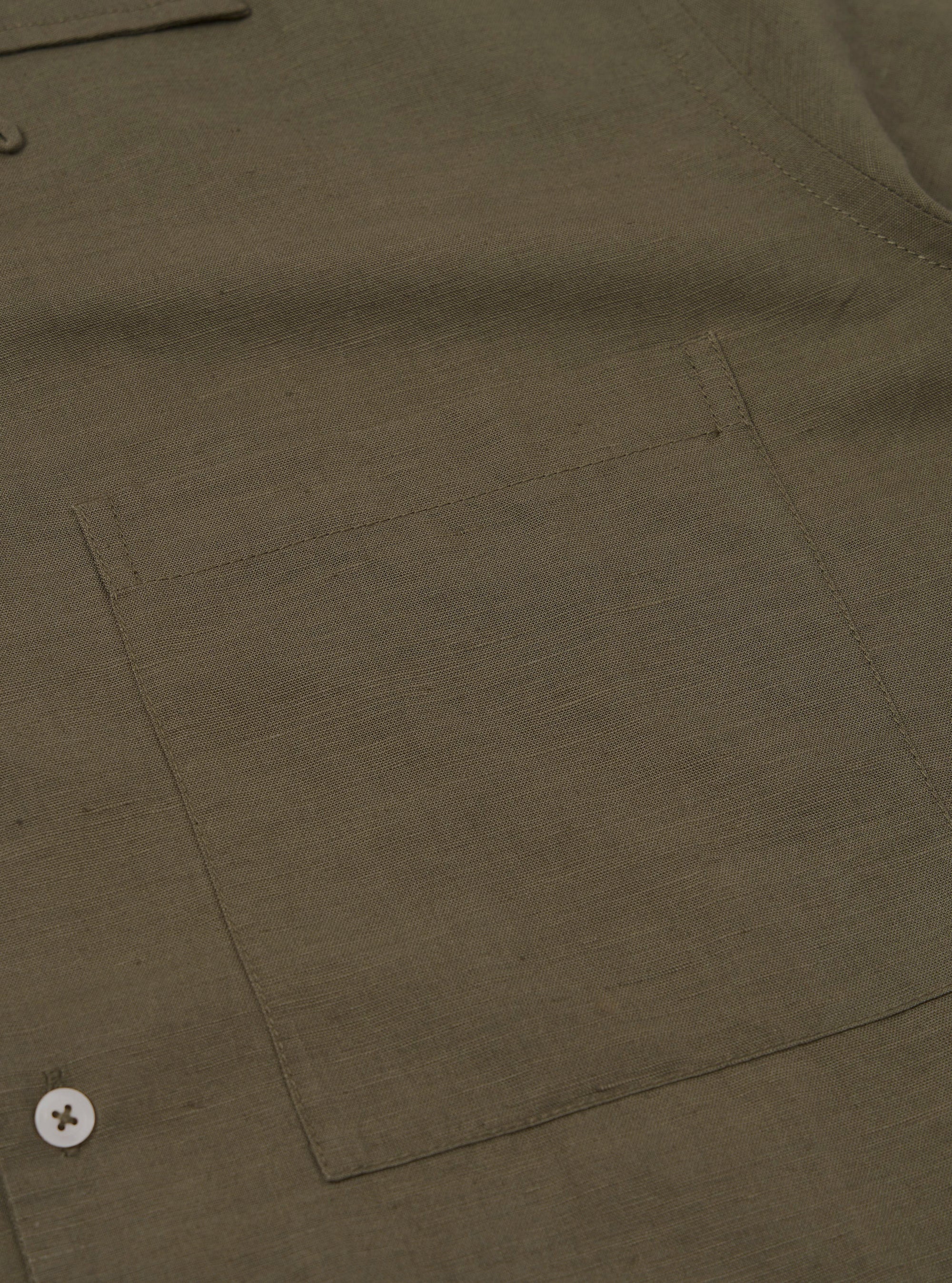 A rear view of the Olive Linen Cotton Shirting Camp Shirt is displayed flat against a plain white background. The image highlights the horizontal back yoke and the straight hemline of the garment.