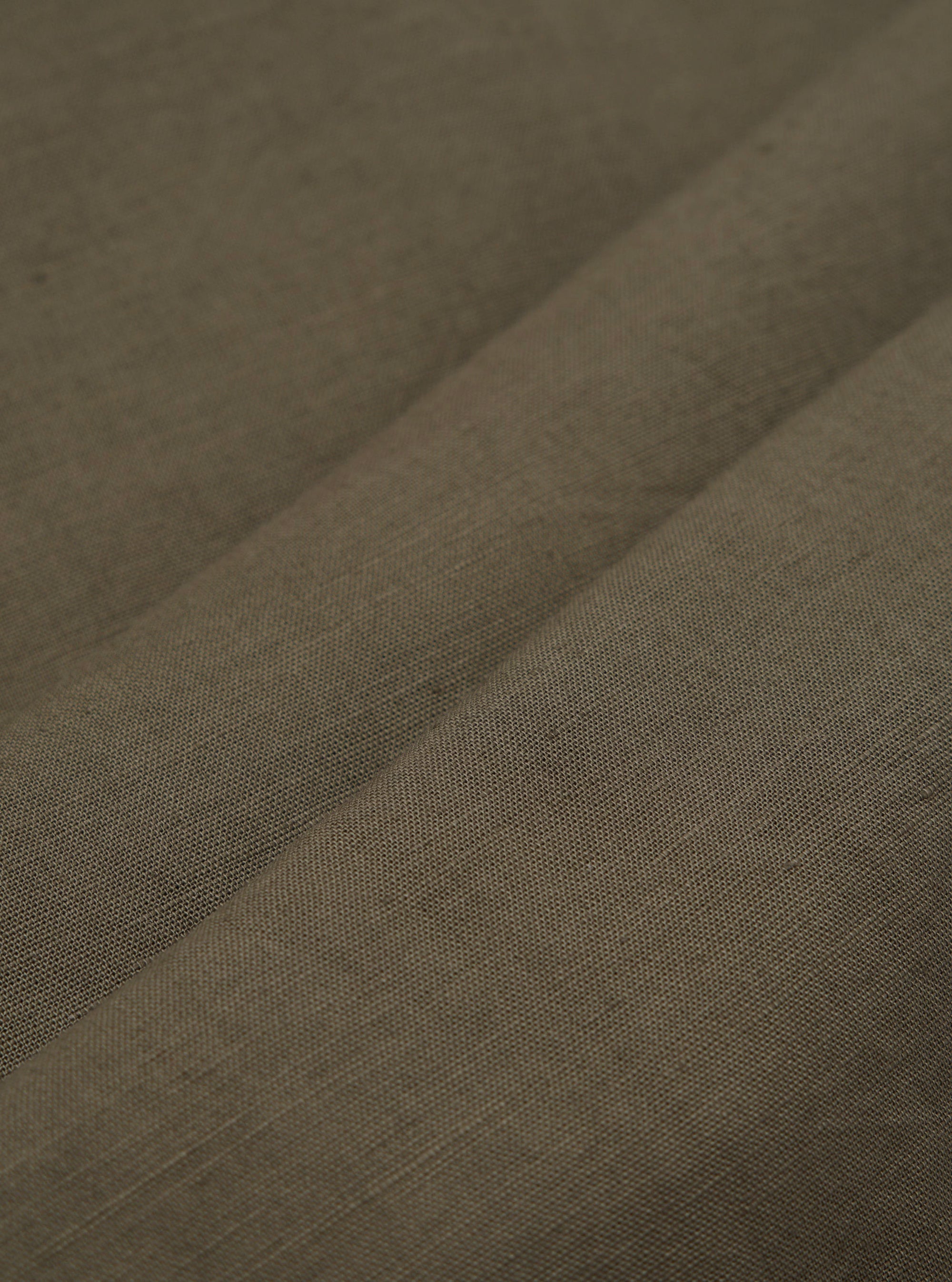 A detailed, close-up fabric swatch of the olive green material used for the Olive Linen Cotton Shirting Camp Shirt. The image highlights the textured weave of the linen-cotton blend fabric.