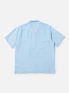 A Pale Blue Linen Cotton Shirting Camp Shirt is shown from the back, displayed flat against a plain white background. The image highlights the short sleeves, straight hem, and the clean construction of the rear shoulder yoke.