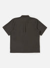 The back of the Brown Marl Tropical Suiting Ewan Shirt is displayed flat against a plain white background. The image highlights the back yoke and a central box pleat designed for a relaxed silhouette. The short sleeves and straight hem are visible, showcasing the textured brown marl fabric.