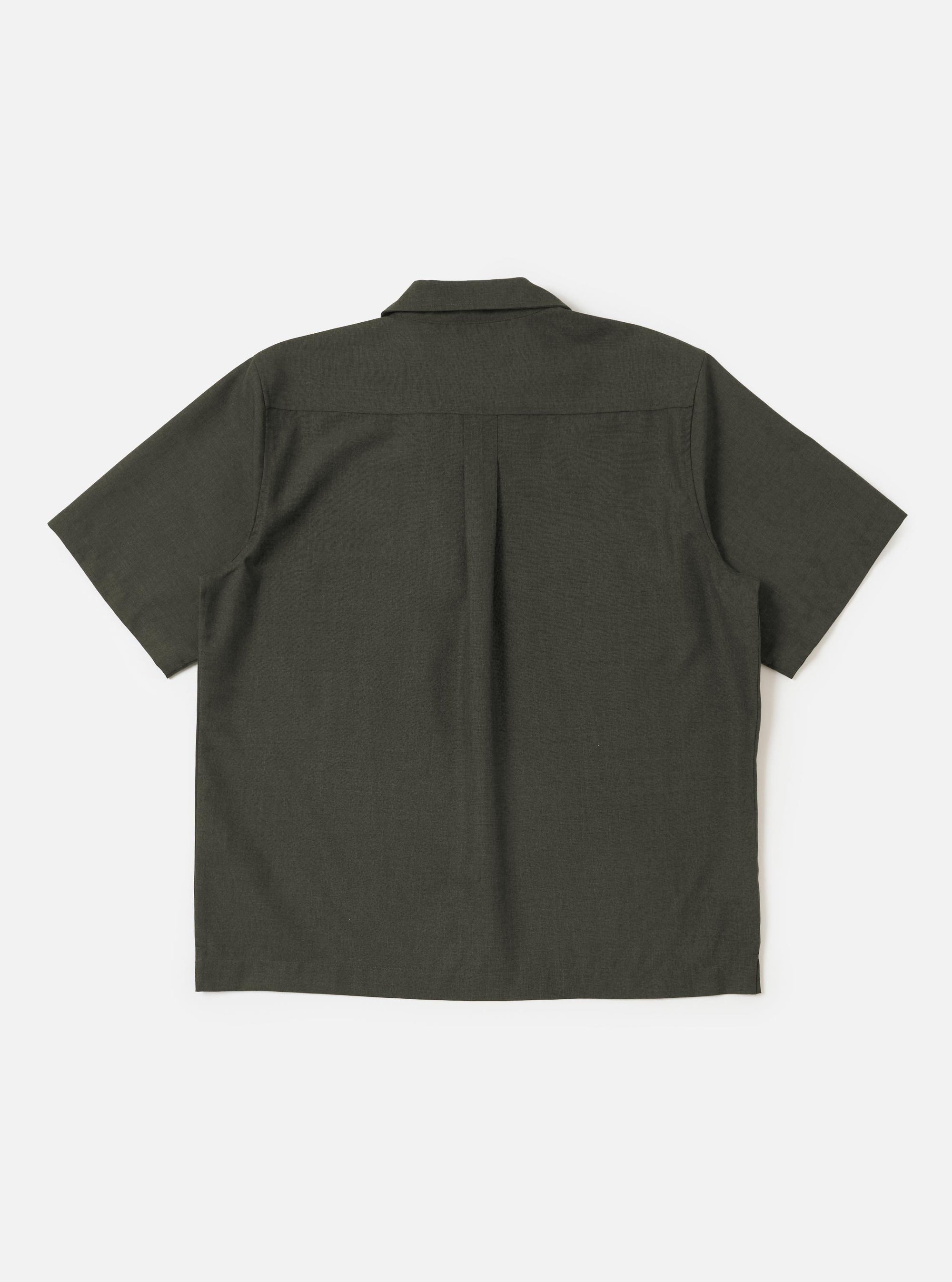 The Olive Marl Tropical Suiting Ewan Shirt is displayed flat against a plain white background. The shirt features an olive green marl fabric, a pullover design with a zip-front neck, and a stand collar.