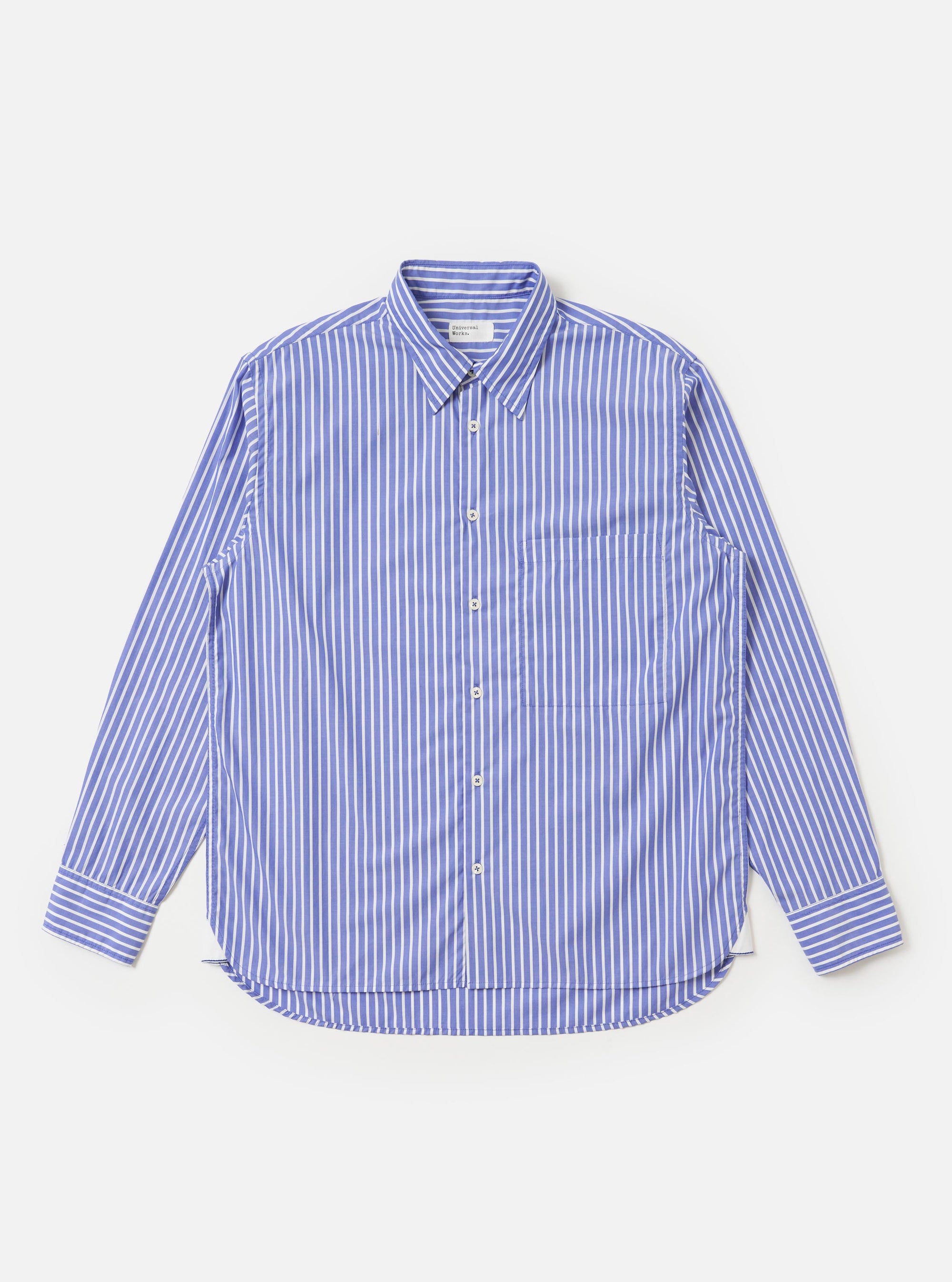 The Blue/White Cotton Stripe Square Pocket Shirt is shown laid flat against a plain white background. The shirt features vertical blue and white stripes, a classic pointed collar, a full button-down front, and a prominent oversized square chest pocket on the left side. The long sleeves are visible, and