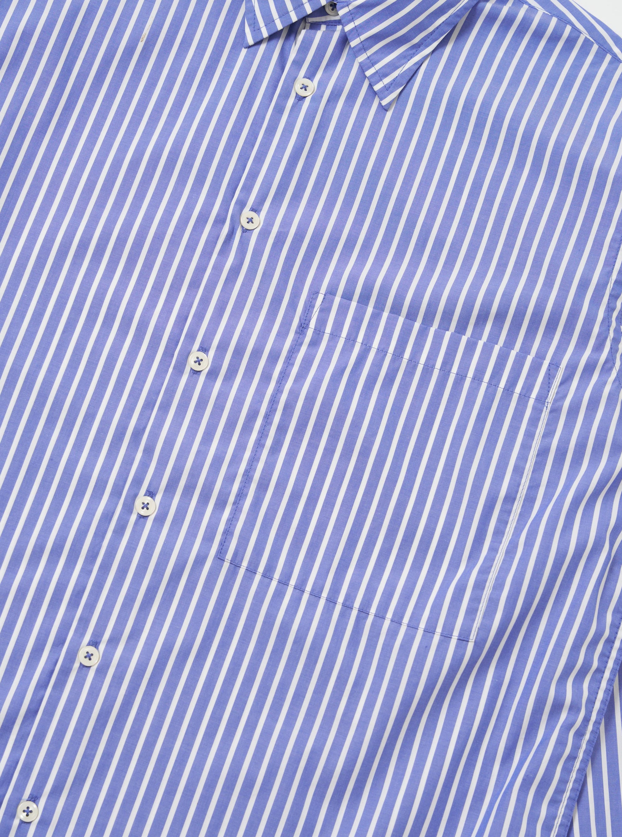 The Blue/White Cotton Stripe Square Pocket Shirt is shown from the back, laid flat against a solid white background. The image highlights the horizontal back yoke and the clean, straight hem of the long-sleeved garment.