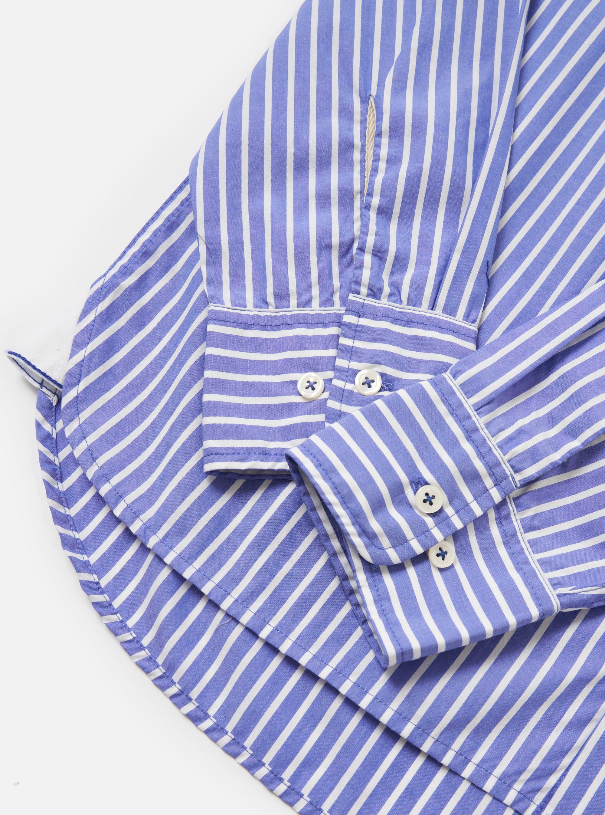 The Blue/White Cotton Stripe Square Pocket Shirt is shown from the back, laid flat against a solid white background. The image highlights the horizontal alignment of the blue and white stripes across the back yoke and the vertical stripes on the main body of the shirt.