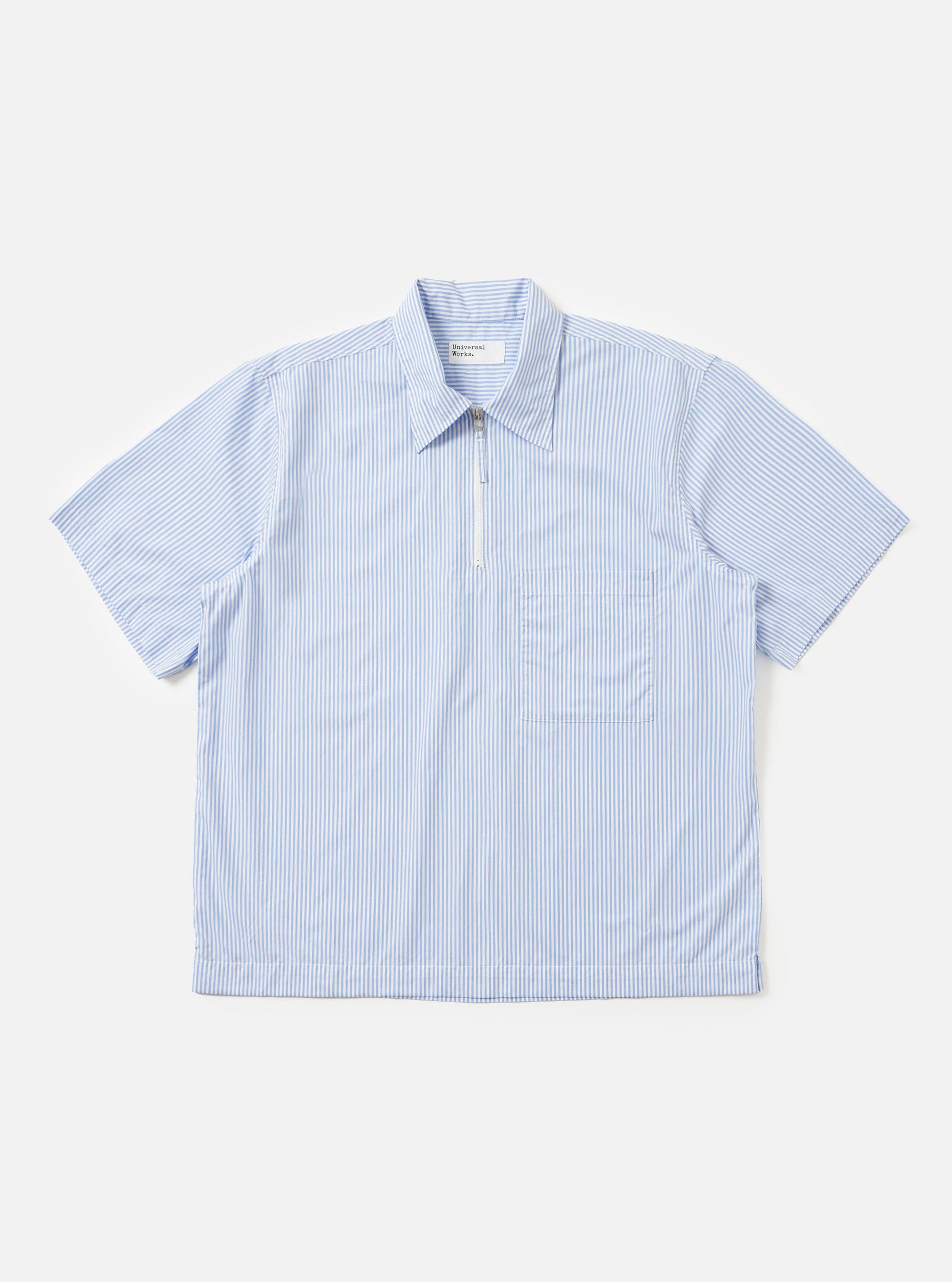 The Sky/White Classic Nipon Stripe Ewan Shirt is shown laid flat against a plain white background. The shirt features a vertical sky blue and white stripe pattern, a classic collar, and a quarter-zip pullover design.