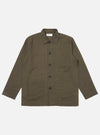 The Olive Linen Cotton Shirting Bakers Overshirt is shown laid flat against a solid white background. The garment features an olive green color, a classic one-piece collar, a full button-down front, and four front patch pockets: one asymmetric chest pocket, two large lower pockets, and a single partially concealed coin pocket. The overshirt has a straight hem and unbuttoned cuffs.