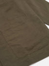 An Olive Linen Cotton Shirting Bakers Overshirt is shown from the back, displayed flat against a plain white background. The image highlights the straight-cut hem and the texture of the olive green linen-cotton fabric.